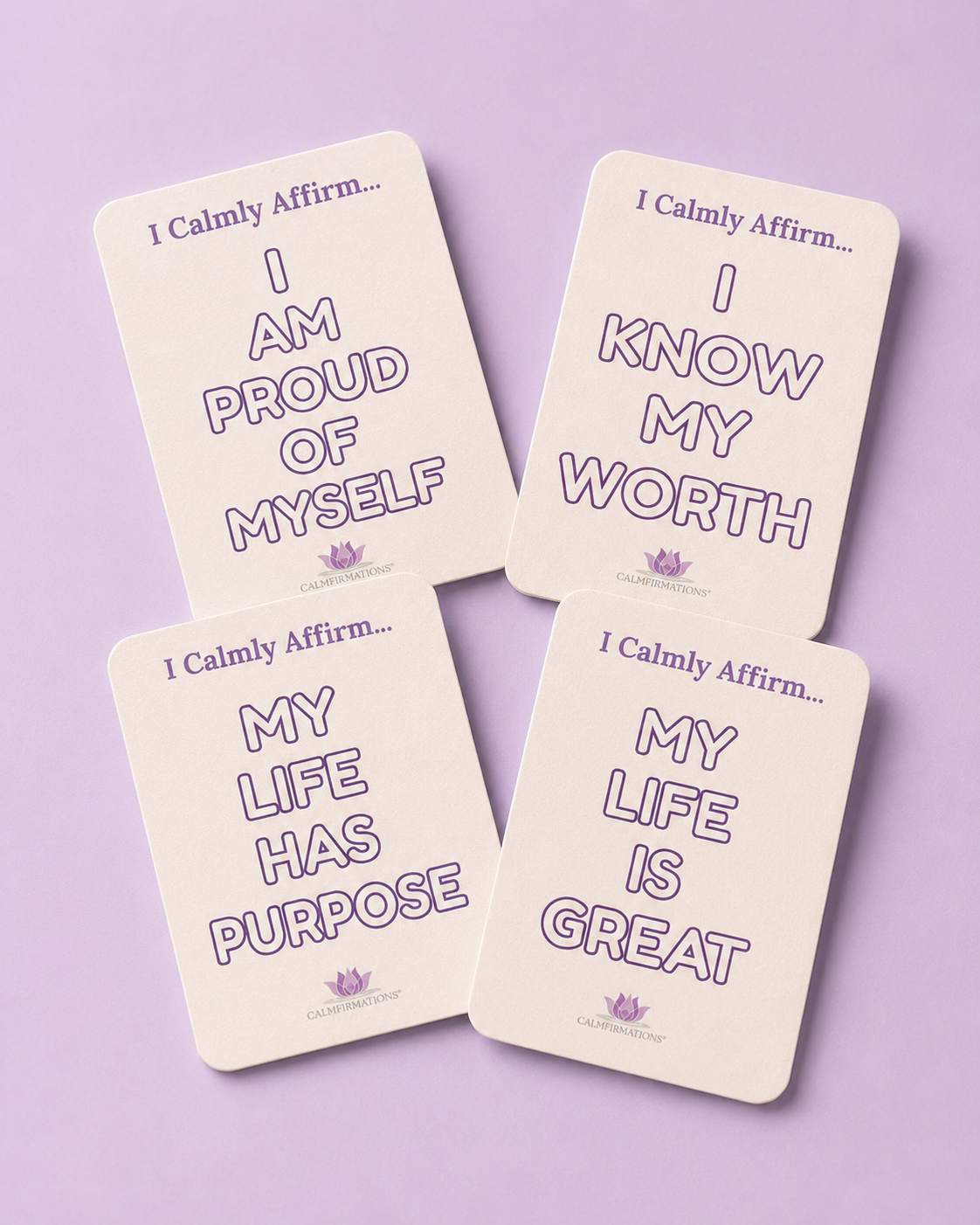 Four cream-colored 'I Calmly Affirm' mini-affirmation coloring cards arranged in a 2x2 grid on a light purple background. Each card features a purple outline font with motivational self-affirmations such as 'I Calmy Affirm...I AM PROUD OF MYSELF' and 'I Calmly Affirm...MY LIFE HAS PURPOSE'.